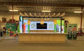 Custom Island Exhibit with Backlit and Non-Backlit Fabric Graphics, Beam Ceiling, Extensive Counter Space, Storage, Sink, and LED Accent Lights