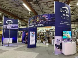 RENTAL: Modified RE-9097 Island Design with 16 ft. High Curved Gravitee Walls, 65" Monitor with HDMI Cable, 55" Monitor with HDMI Cable, RE-1597 White Laminated Curved Counter, SEG Fabric Graphics, and Direct Print Vinyl Applied Graphic